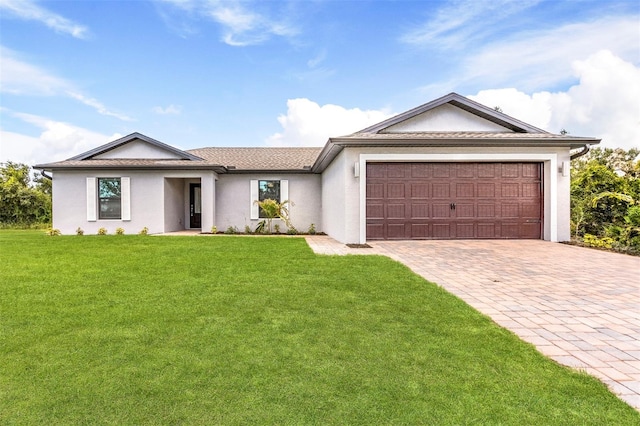 ranch-style home featuring a front lawn and a garage