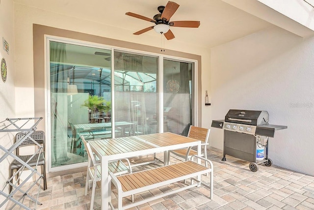 view of patio / terrace featuring area for grilling and ceiling fan