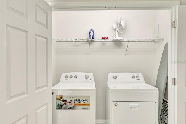 laundry room with independent washer and dryer