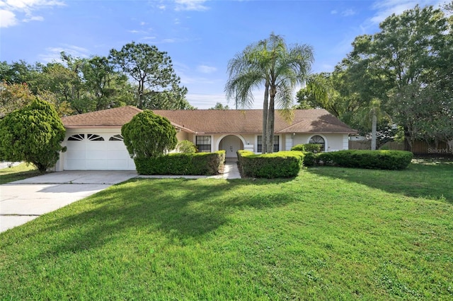 single story home with a garage and a front yard