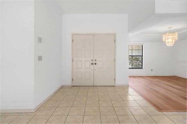 entryway featuring a notable chandelier and light hardwood / wood-style flooring