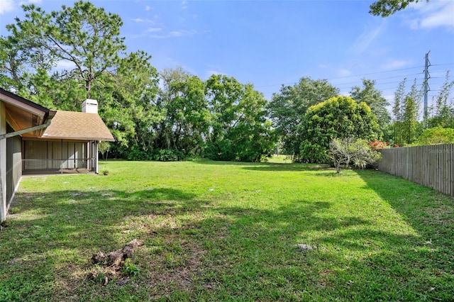 view of yard featuring a sunroom