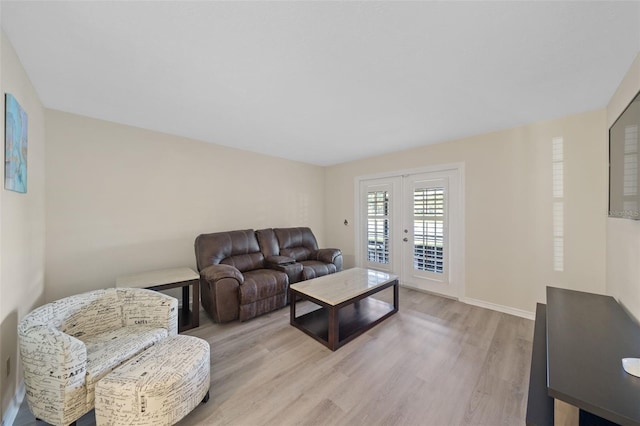 living room with light hardwood / wood-style flooring