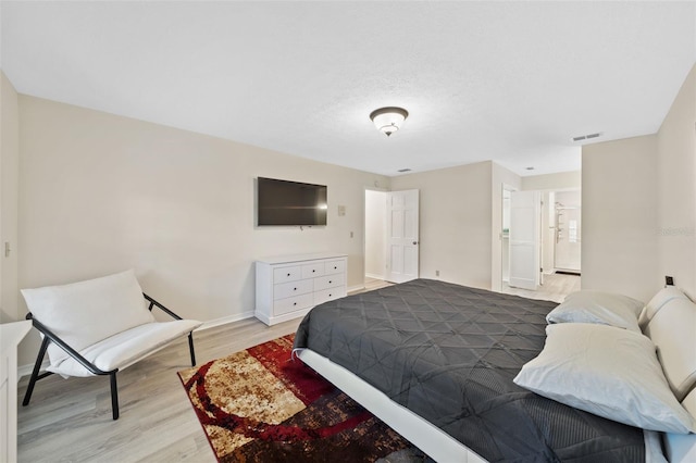 bedroom featuring light wood-type flooring