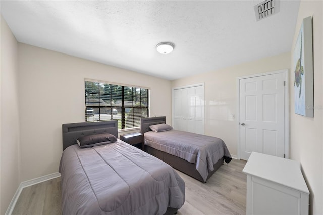 bedroom with light hardwood / wood-style flooring