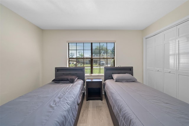 bedroom featuring a closet and light hardwood / wood-style floors