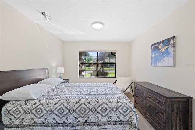 bedroom with light hardwood / wood-style floors