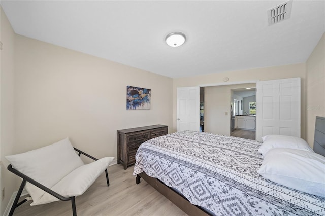 bedroom with light hardwood / wood-style flooring