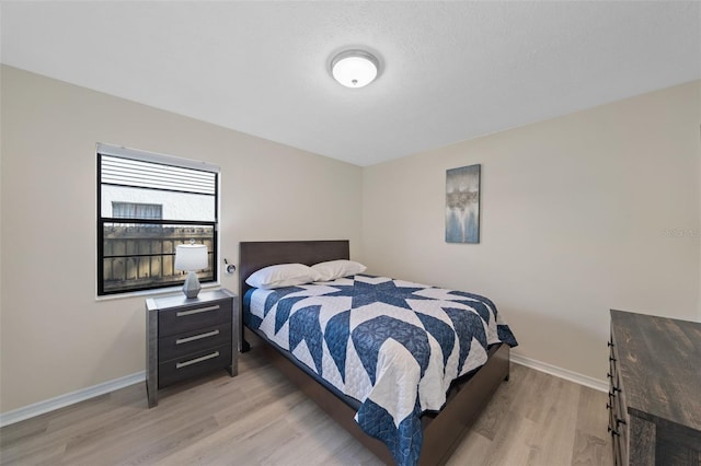 bedroom with light hardwood / wood-style flooring