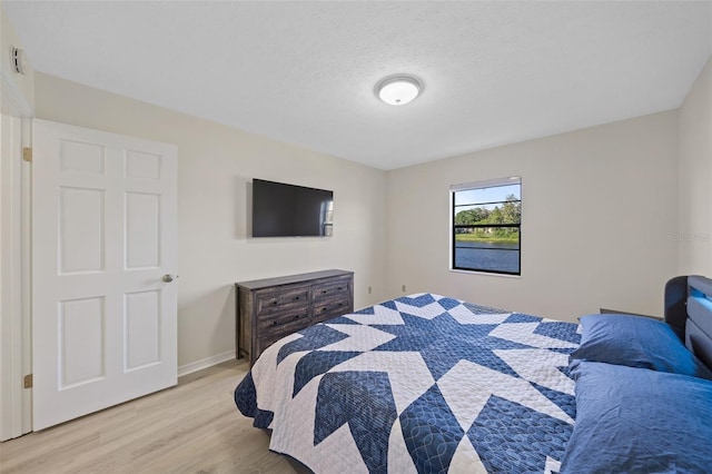 bedroom featuring light hardwood / wood-style floors