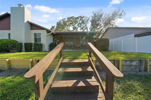 view of playground with a sunroom