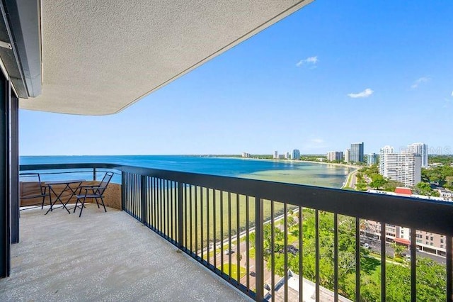 balcony featuring a water view