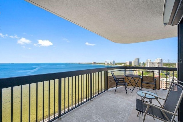 balcony featuring a water view