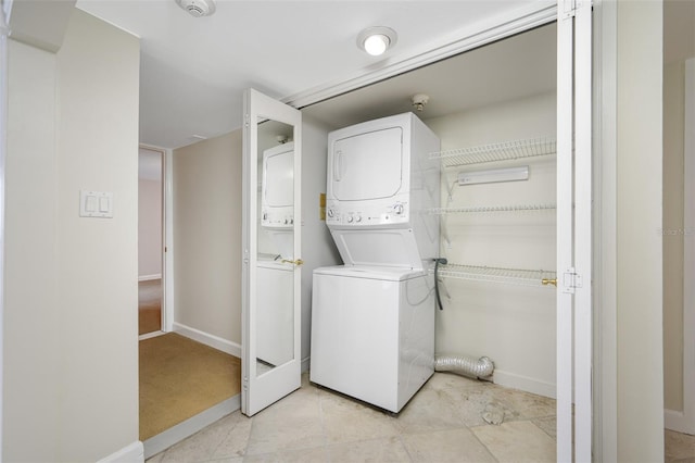 laundry area featuring stacked washer and dryer