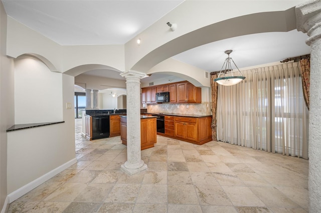 kitchen featuring decorative light fixtures, sink, decorative backsplash, and black appliances