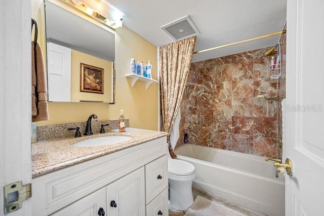 full bathroom featuring vanity, toilet, and shower / bath combo