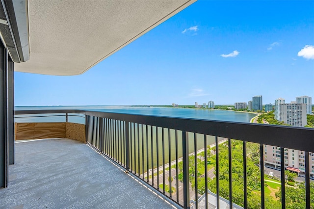 balcony featuring a water view