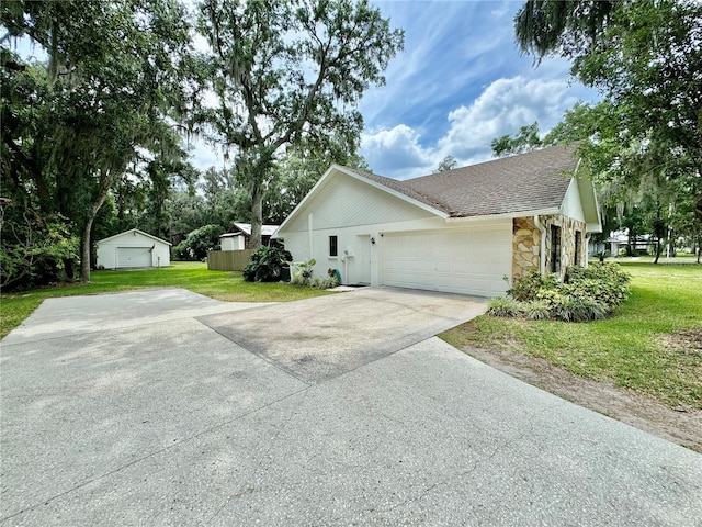 view of home's exterior featuring a yard and a garage