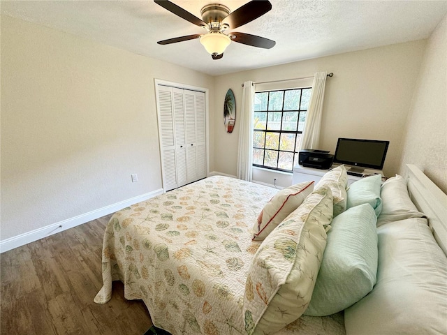 bedroom featuring a textured ceiling, a closet, ceiling fan, and hardwood / wood-style flooring