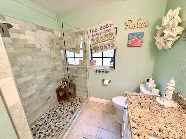 bathroom featuring walk in shower, tile patterned floors, a textured ceiling, and toilet