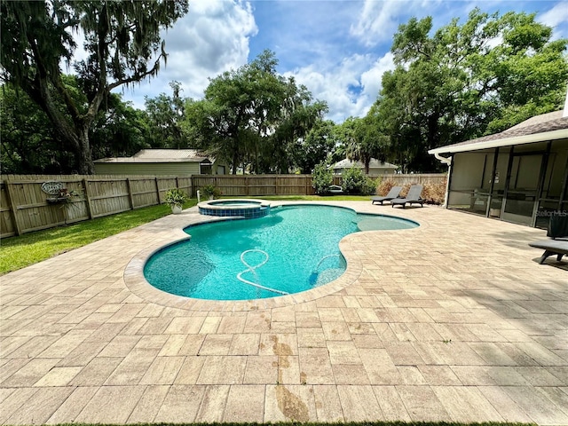 view of swimming pool featuring an in ground hot tub, a patio area, and a sunroom