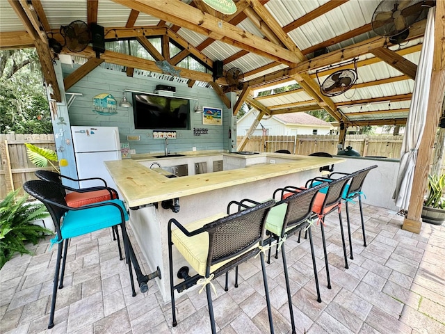 view of patio with a gazebo and an outdoor wet bar