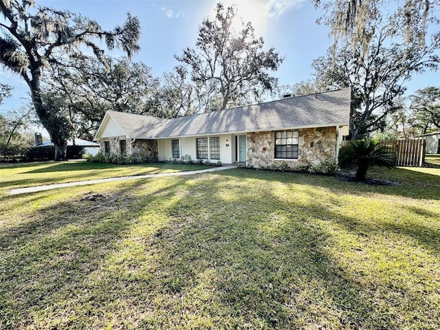 single story home featuring a front yard