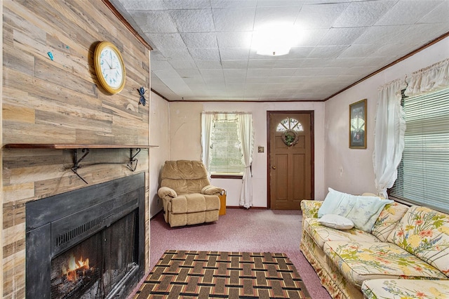 carpeted living room with wooden walls and crown molding