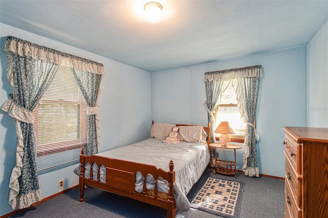 carpeted bedroom with multiple windows