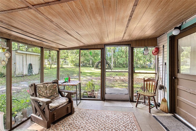 sunroom / solarium featuring wooden ceiling and lofted ceiling