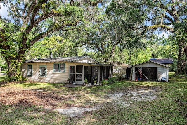 rear view of property with a lawn