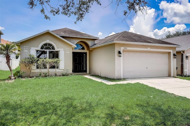 ranch-style home with a front lawn and a garage