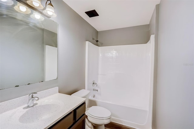 full bathroom featuring toilet, vanity, shower / bath combination, and hardwood / wood-style flooring