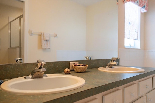 bathroom featuring vanity and walk in shower