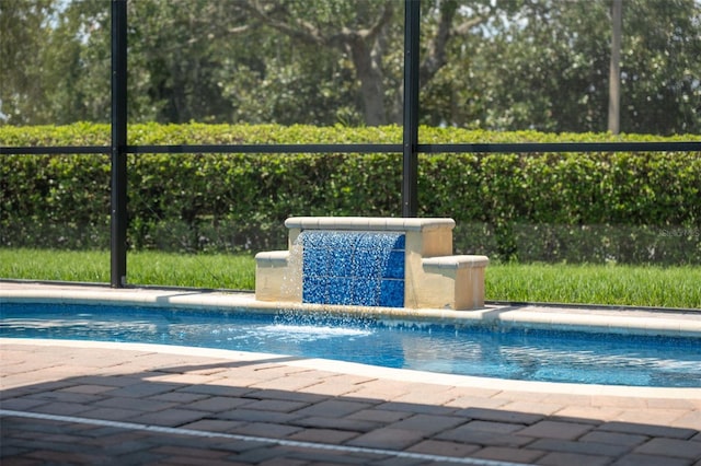 view of pool featuring pool water feature