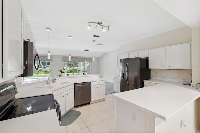 kitchen with pendant lighting, sink, appliances with stainless steel finishes, light tile patterned flooring, and white cabinetry