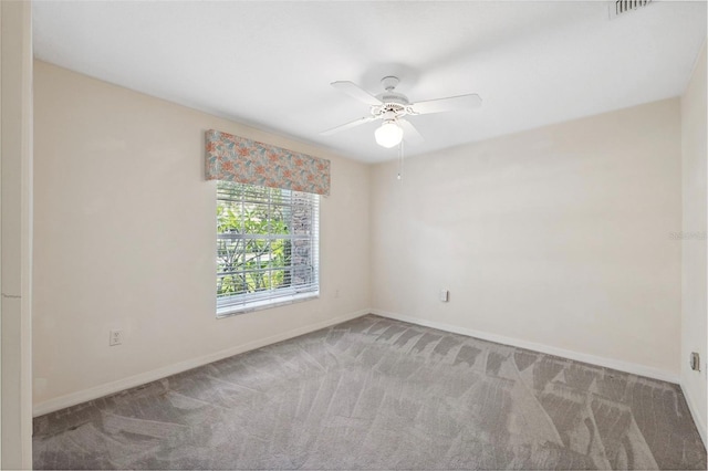 carpeted empty room with ceiling fan