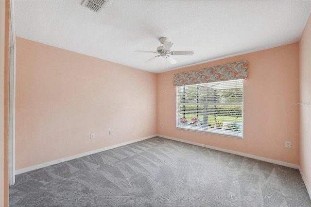 empty room with carpet and ceiling fan