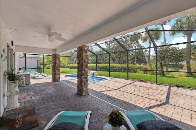 view of patio / terrace featuring a lanai and ceiling fan