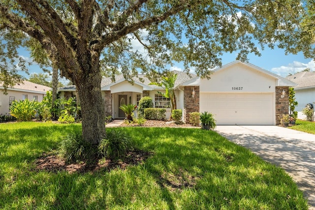 ranch-style house with a garage and a front lawn