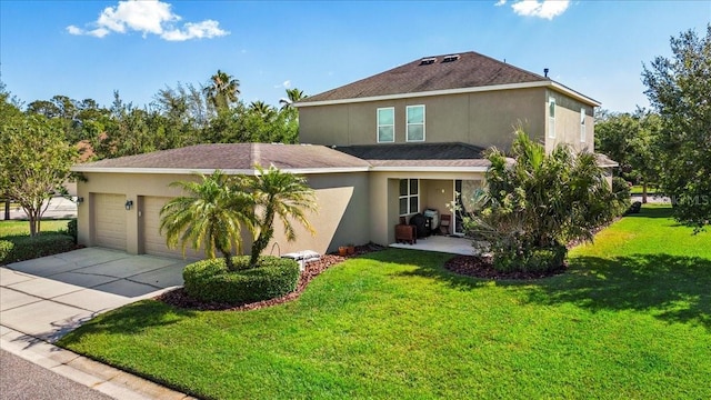 view of front of home with a front lawn and a garage