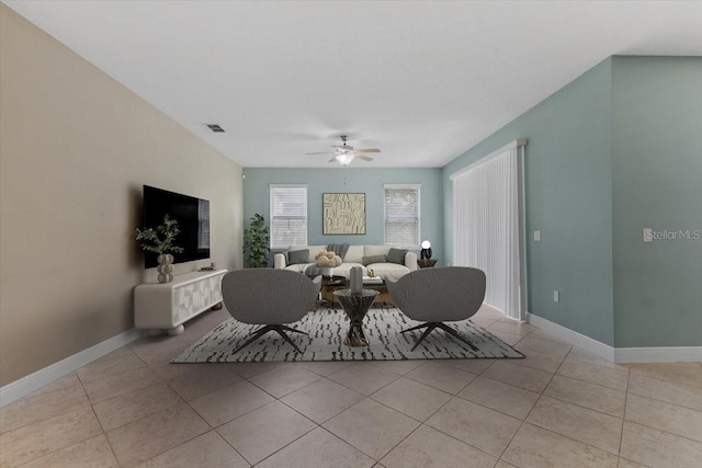 tiled living room featuring ceiling fan