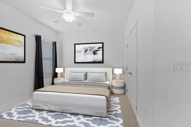 bedroom featuring ceiling fan and carpet flooring