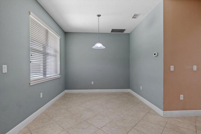 unfurnished dining area with light tile patterned floors