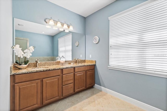 bathroom with vanity and tile patterned flooring