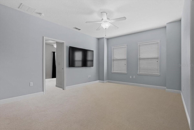 empty room with light carpet and ceiling fan