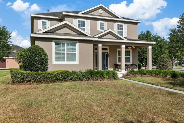 view of front of house with covered porch and a front yard