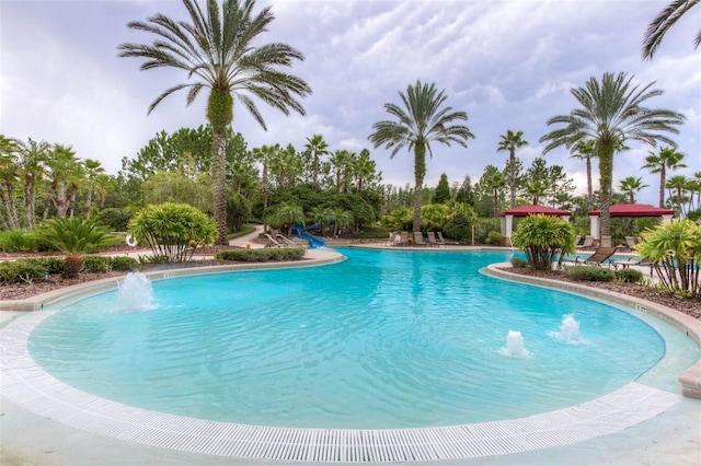 view of pool with pool water feature