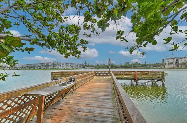 view of dock with a water view and sink