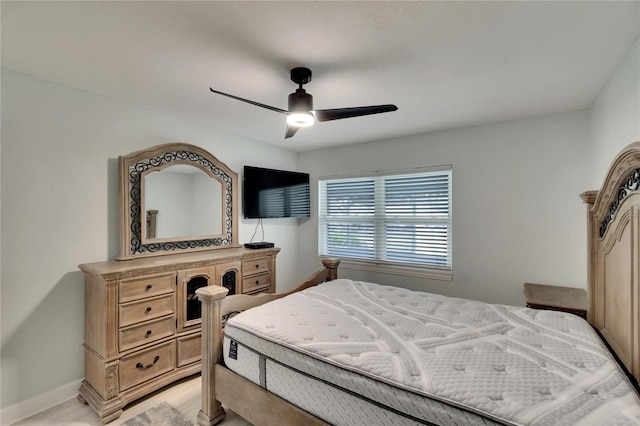 bedroom with ceiling fan and light wood-type flooring